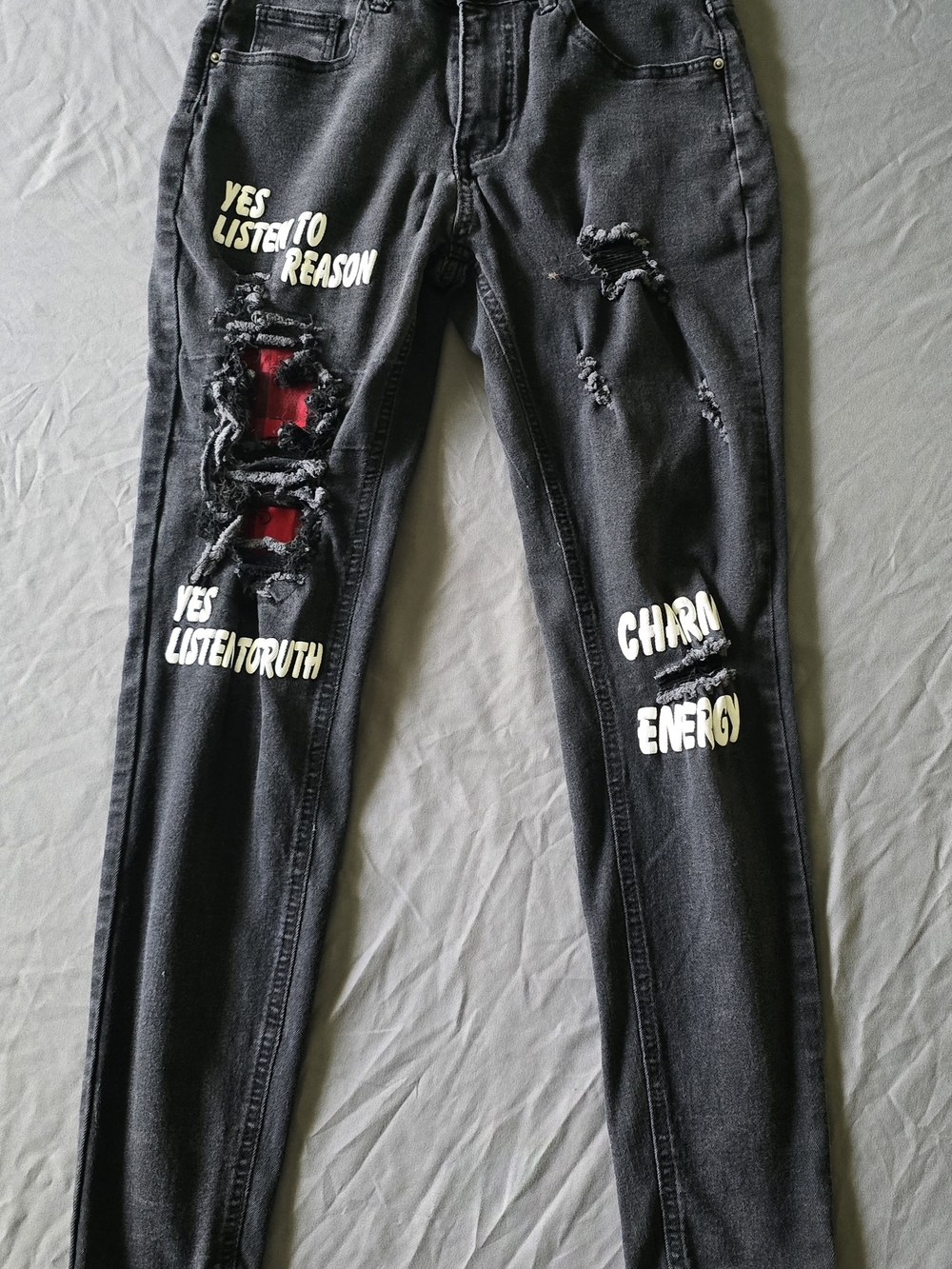 Black Skinny Jeans with Red Underlay and Graphic Text